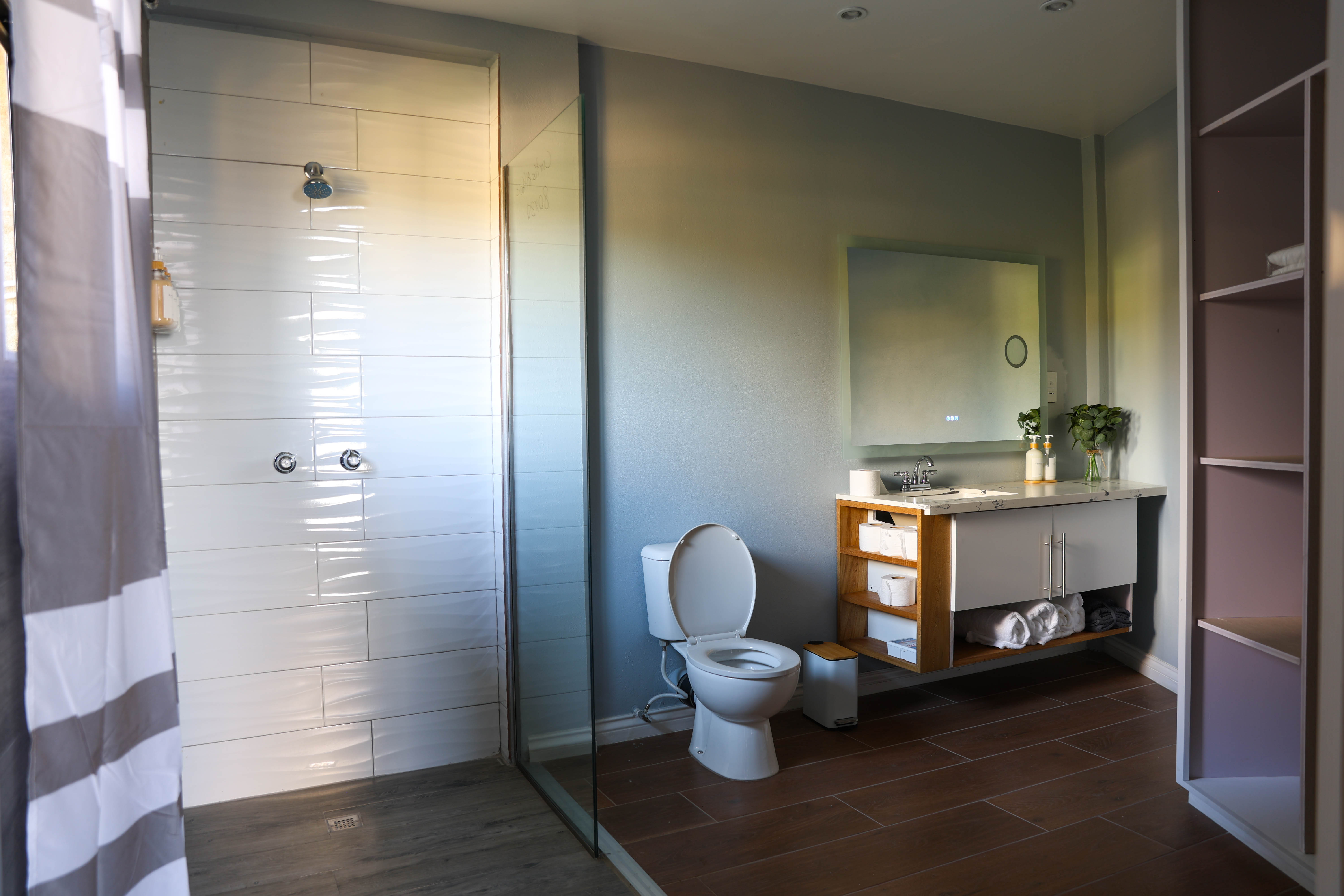 Master ensuite at Serene Sunset Escapes Saint Lucia — spacious glass panel shower and modern vanity